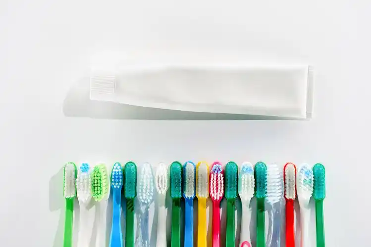 Bulk manufacturing of sensitive teeth toothpaste in a GMP-certified facility, showcasing production equipment and professional formulation process for businesses seeking contract manufacturing services.