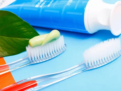 Pharmacy shelf stocked with wholesale toothpaste for pharmacies including Colgate Total, Crest 3D White and private label tubes – high margin oral care ready to sell