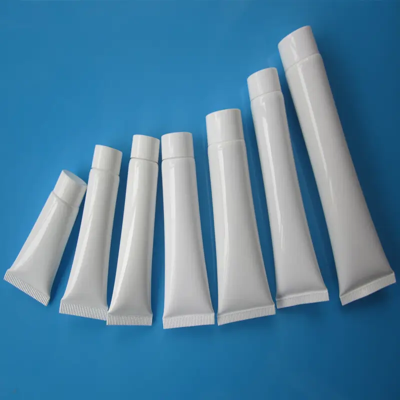 Modern toothpaste tube manufacturing facility showing high-speed production lines and quality control process for reliable squeezable tube toothpaste suppliers